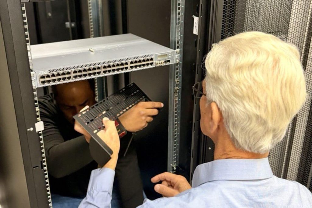 Zero U Cable Manager being installed by data center operator