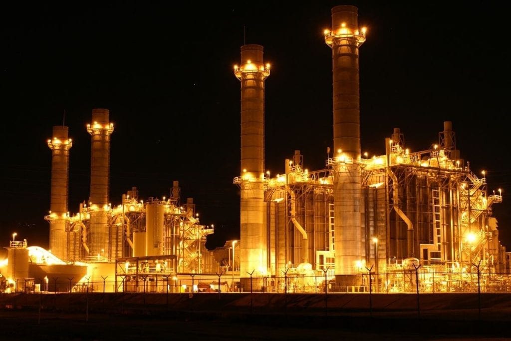 Power plant at night working double-time due to AI power demands